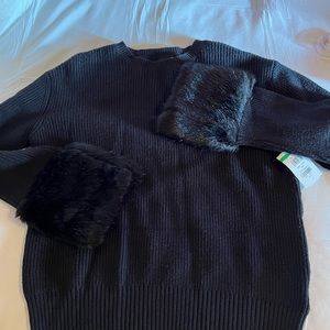 Black sweater with fur cuffs